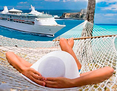 relaxing in hammock with cruise ship in distance